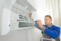 man repairing Air Conditioner